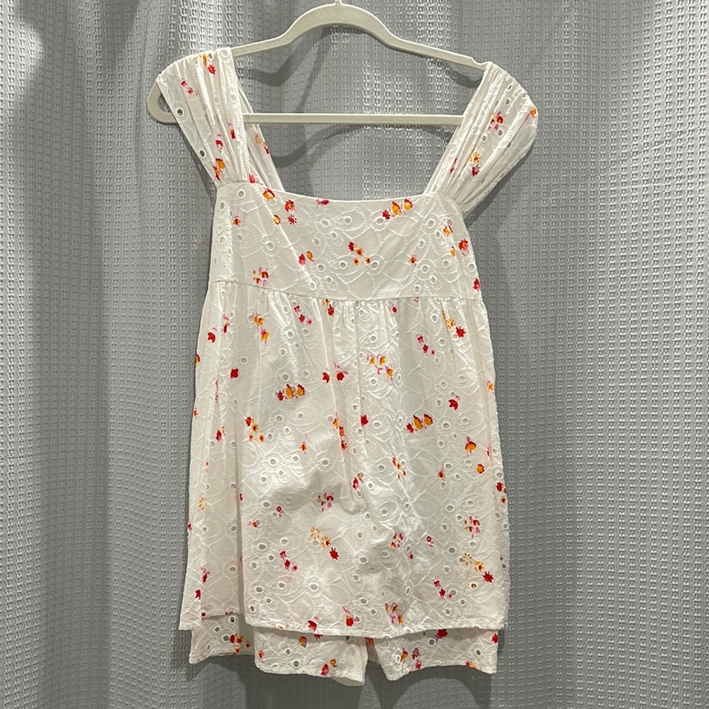 Baby doll romper from Urban Outfitters. White with small florals. Size small.